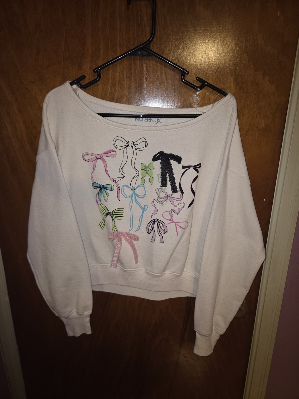 Modern Lux Cream Off-the-Shoulder Sweatshirt with Multicolor Bow Accents